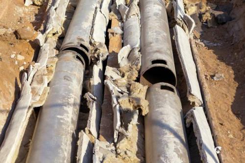 Old pipes with asbestos insulation